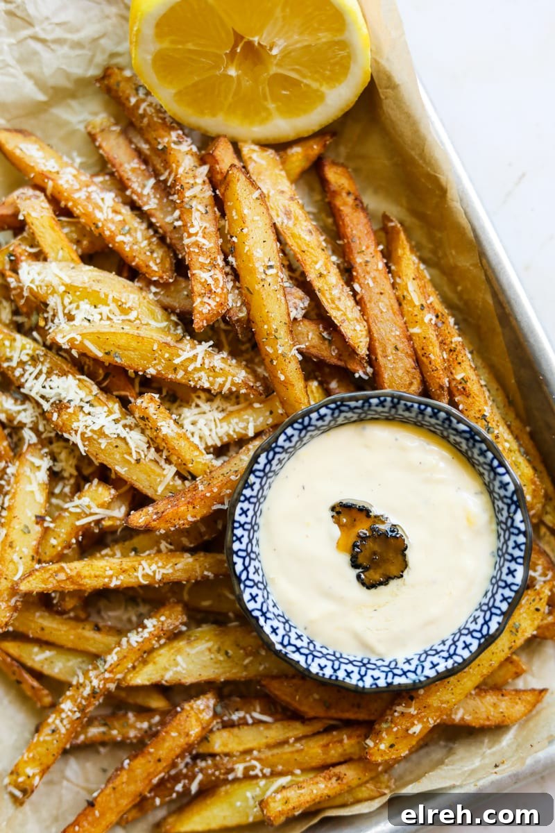 22 Delicious Sides to Serve with Chicken Wings 20 Parmesan truffle friends on a tray with truffle lemon aioli.