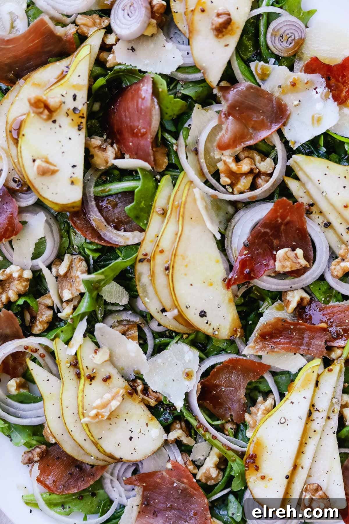 22 Delicious Sides to Serve with Chicken Wings 24 Closeup shot of arugula salad with pear, crispy prosciutto, shallots, parmigiano-reggiano, and walnuts.