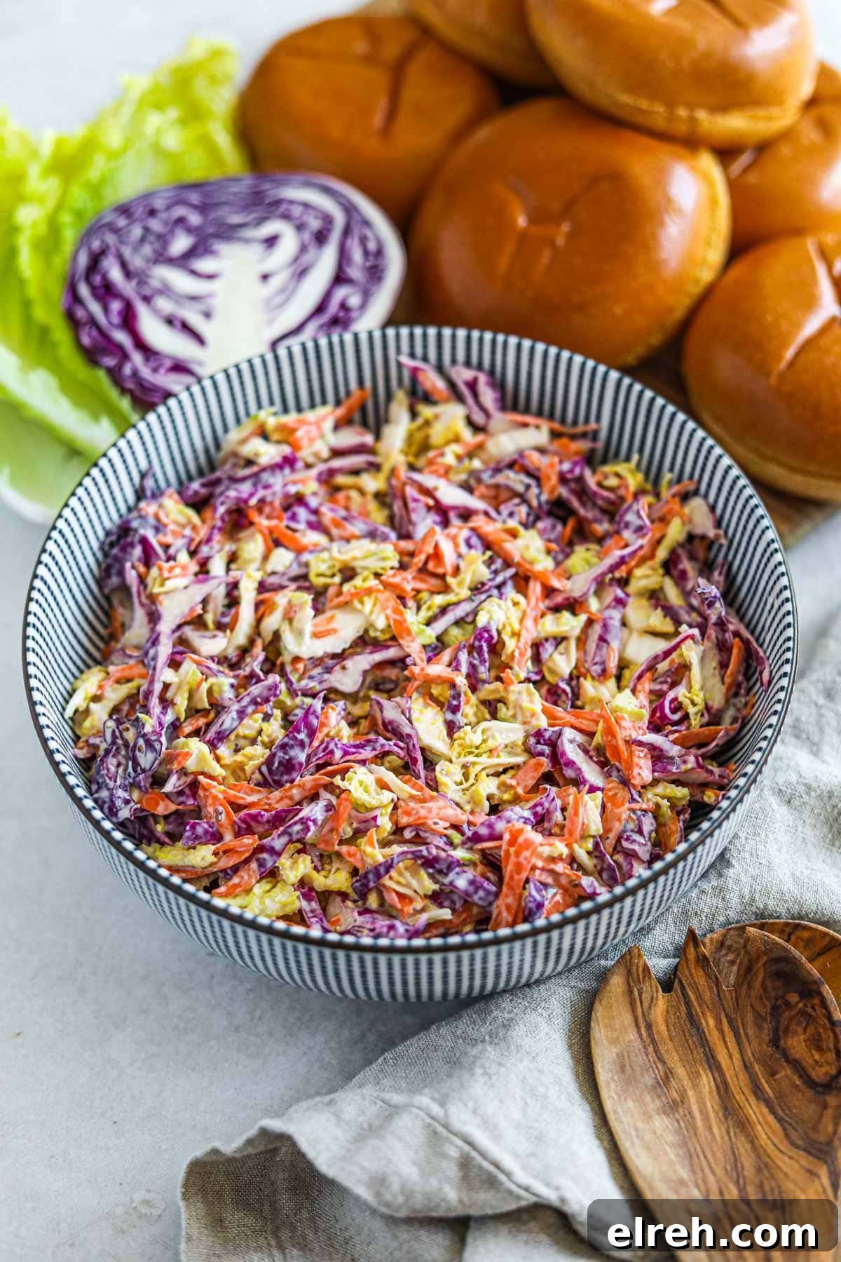 22 Delicious Sides to Serve with Chicken Wings 7 Healthy Greek Yogurt Coleslaw (with Napa and Red Cabbage) in a striped Japanese bowl.