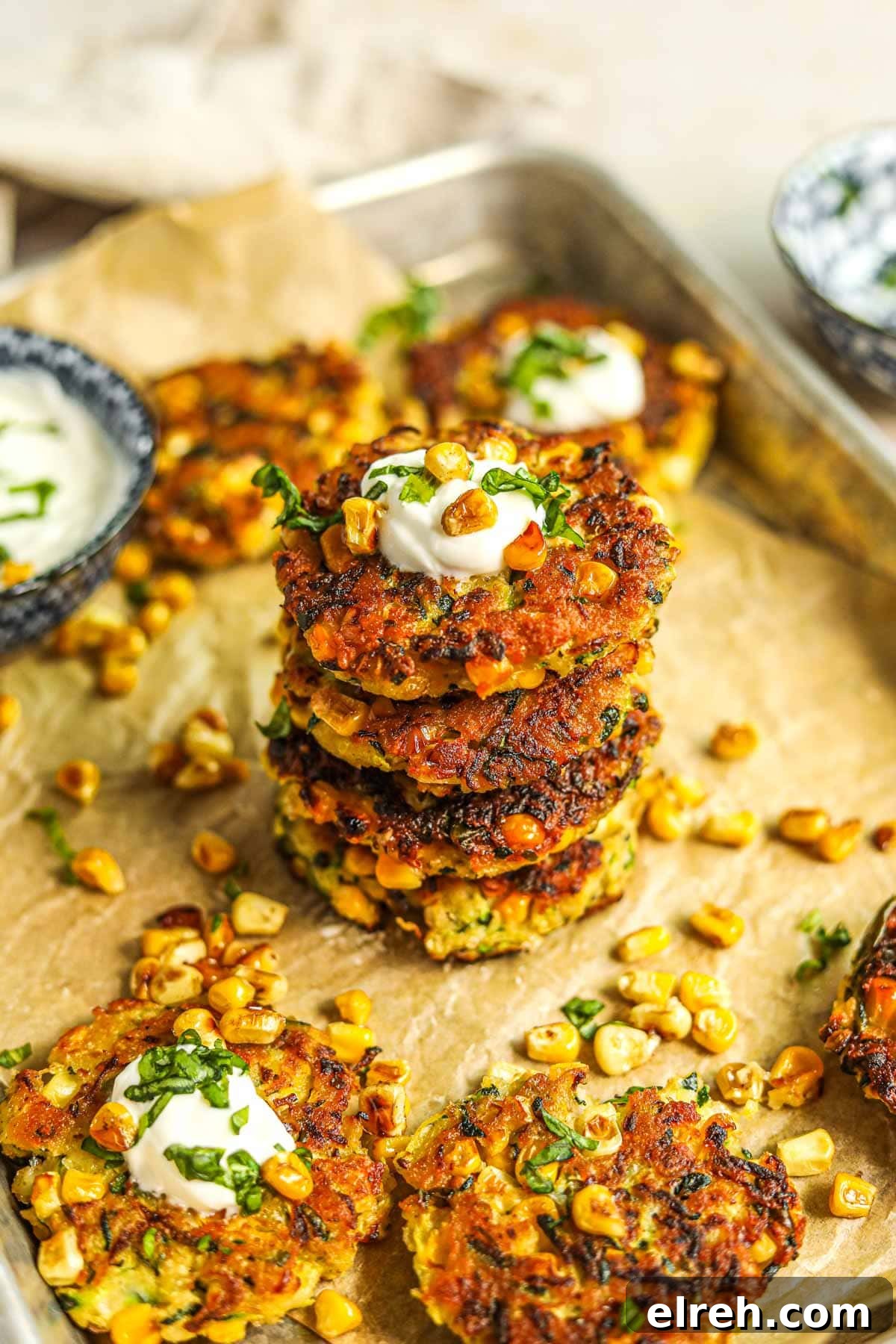 22 Delicious Sides to Serve with Chicken Wings 8 Healthy corn and zucchini fritter stacked and topped with greek yogurt, roasted corn, and basil.