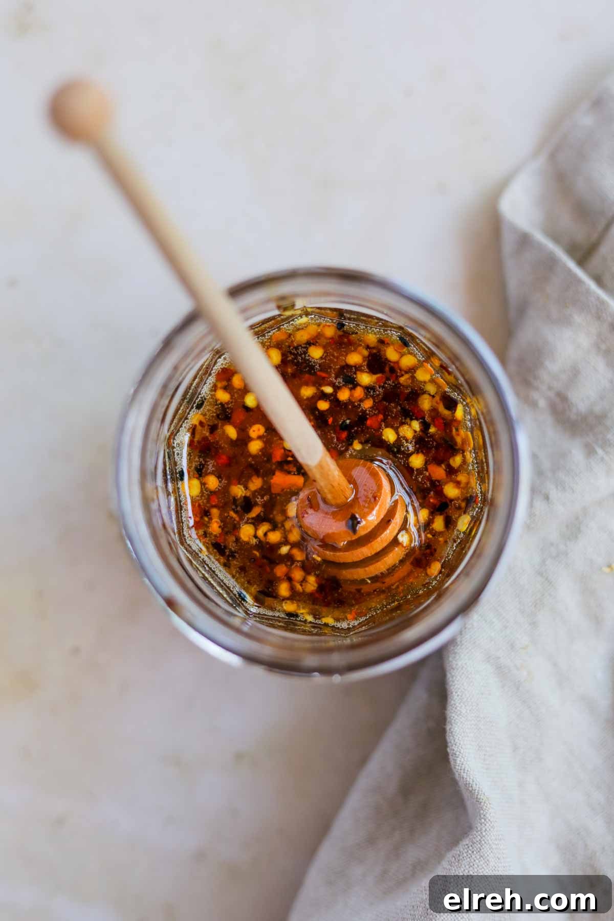 22 Delicious Sides to Serve with Chicken Wings 10 Spicy hot honey sauce in a jar with honey dripper.