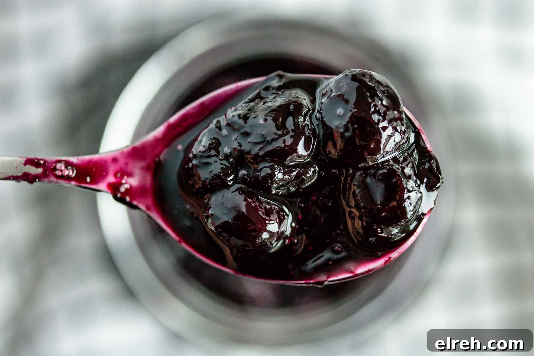 Close up of blueberry topping in a spoon