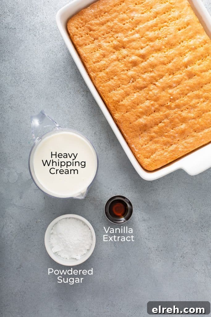 Whipped cream ingredients next to an unfrosted cake