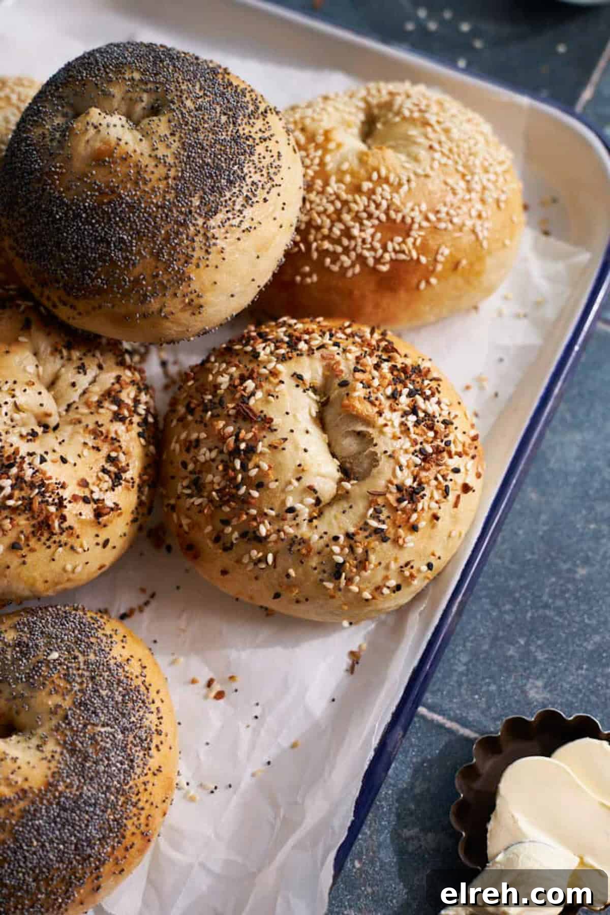 A pile of Sourdough Discard Bagels on a white tray. 