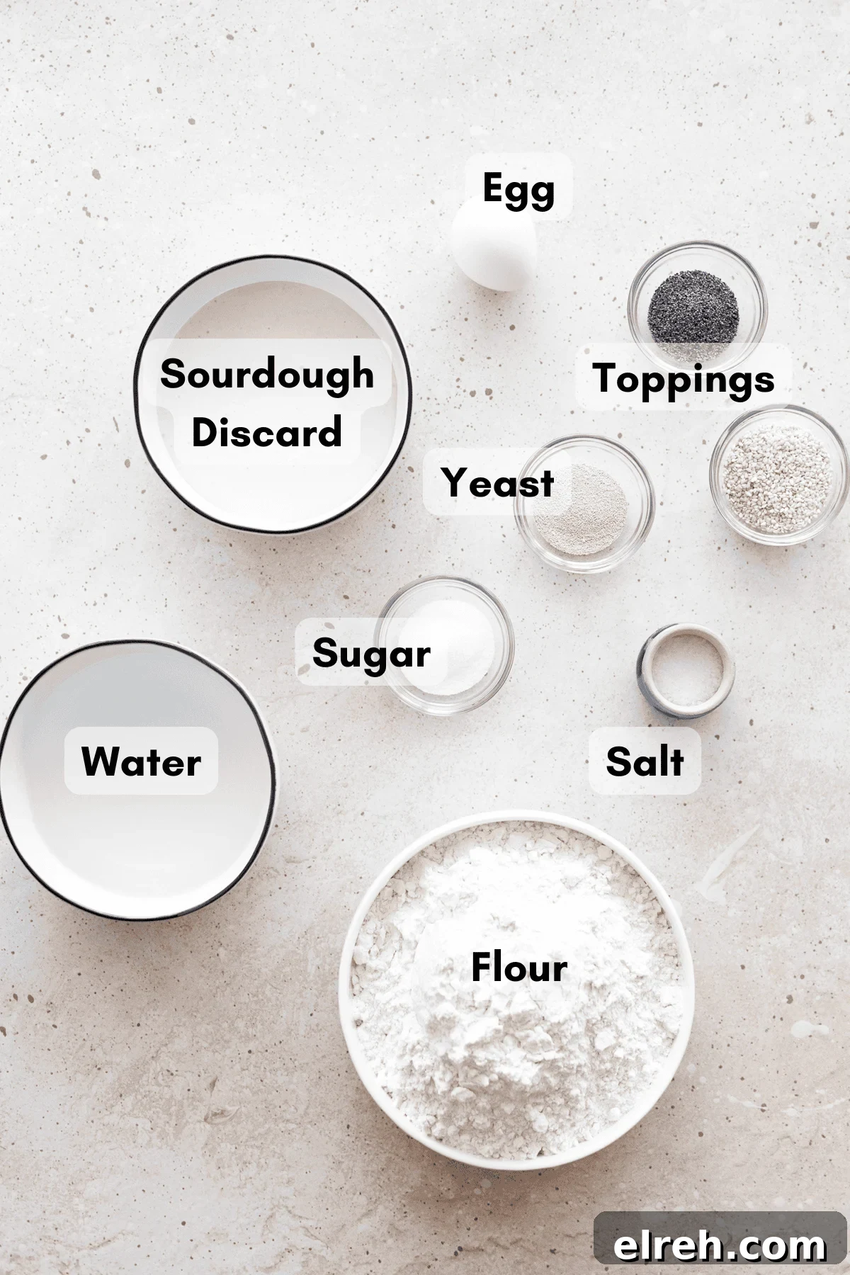 Ingredients for Sourdough Discard Bagels in small bowls. 