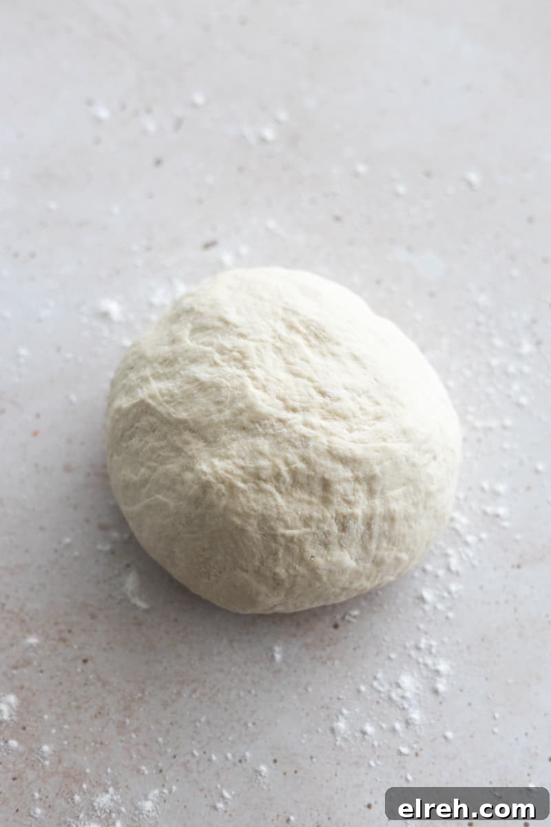 Smooth dough in a ball after kneading. 