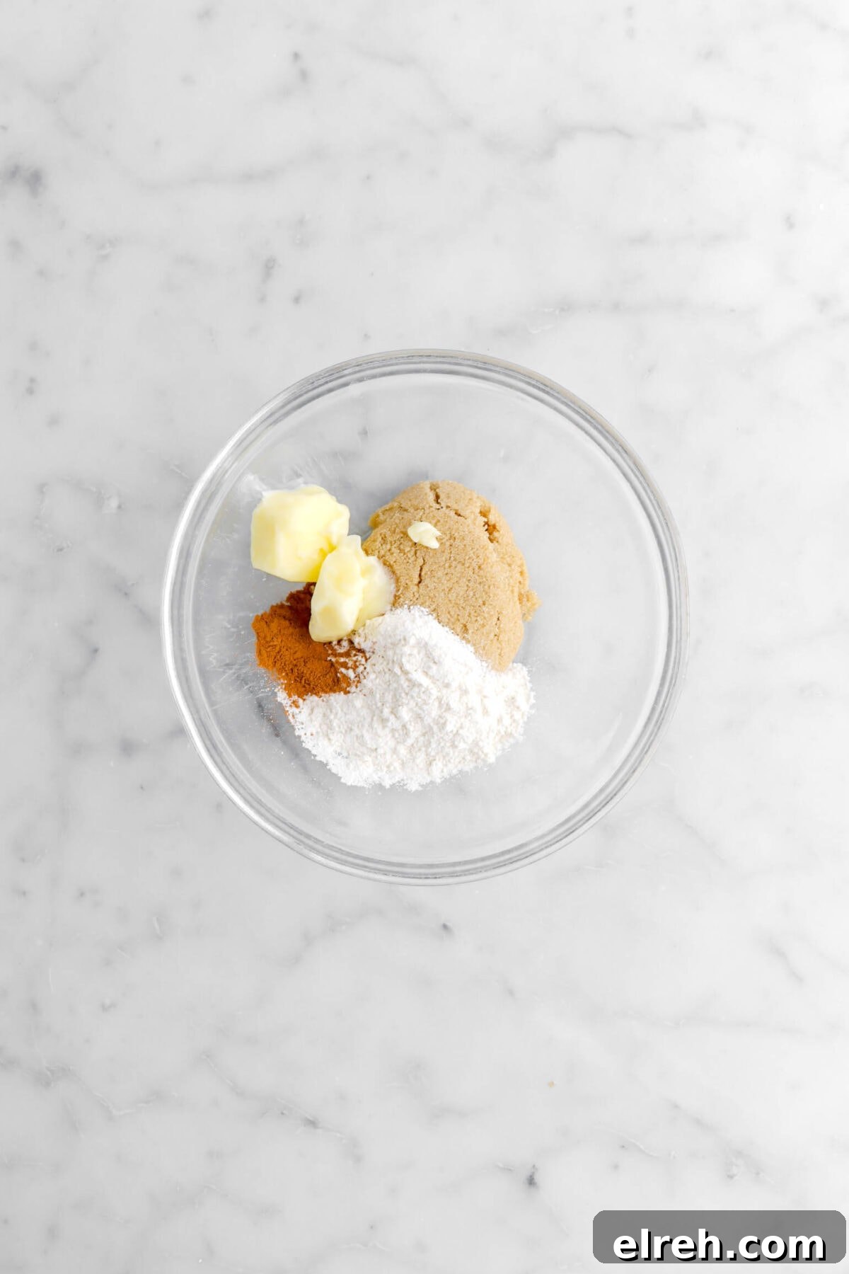 Peach Cobbler Crisp with Brown Sugar and Cinnamon 10 butter, brown sugar, cinnamon, and flour in glass bowl.