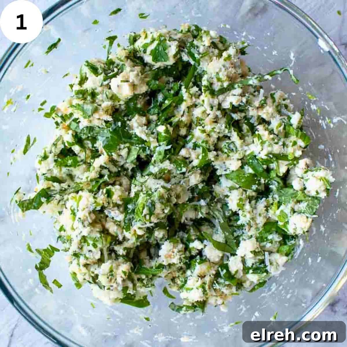 Ricotta cheese and herb filling in a bowl.