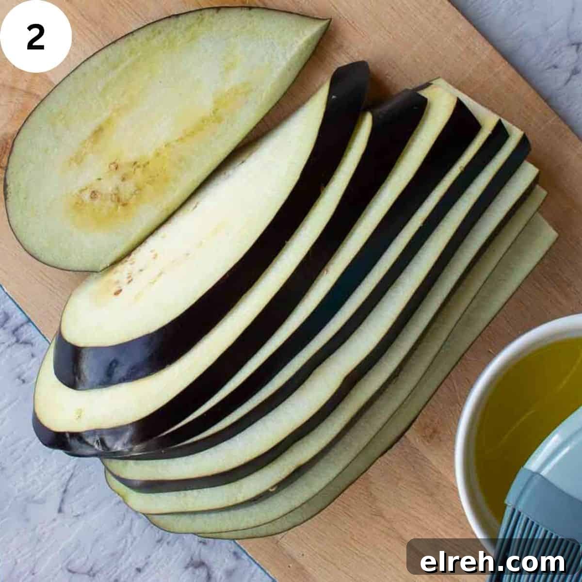 An eggplant sliced lengthwise.