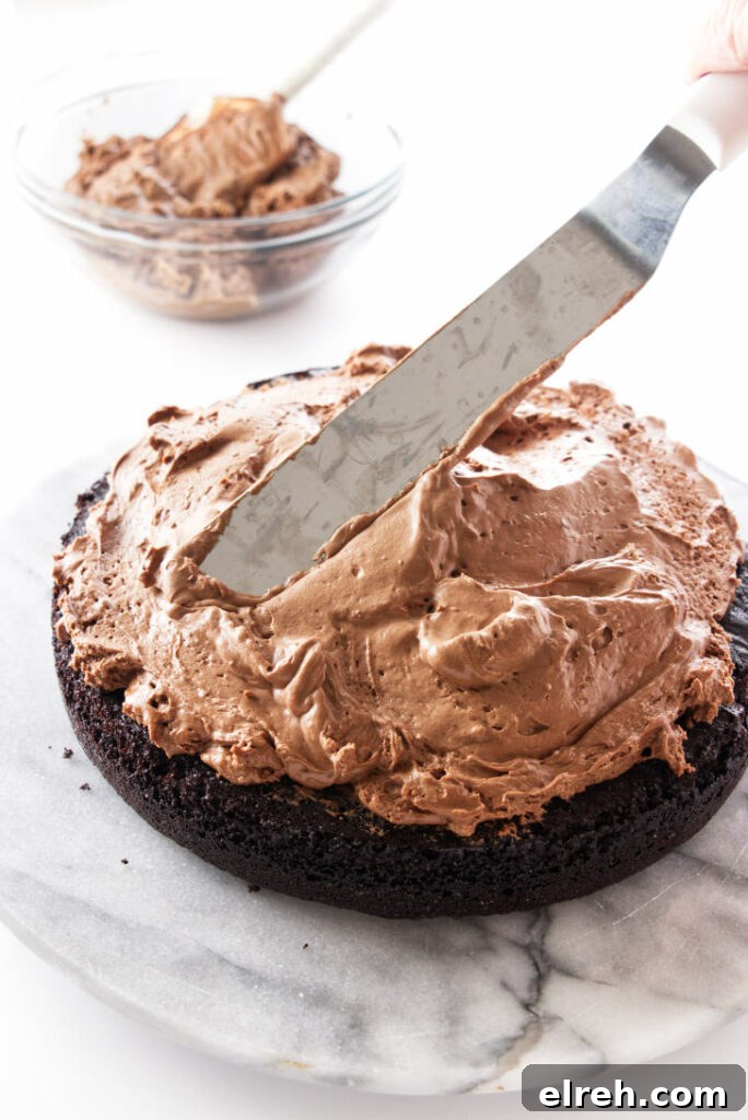 Irish Coffee Chocolate Cake Recipe 5 Mousse being spread on a cake layer