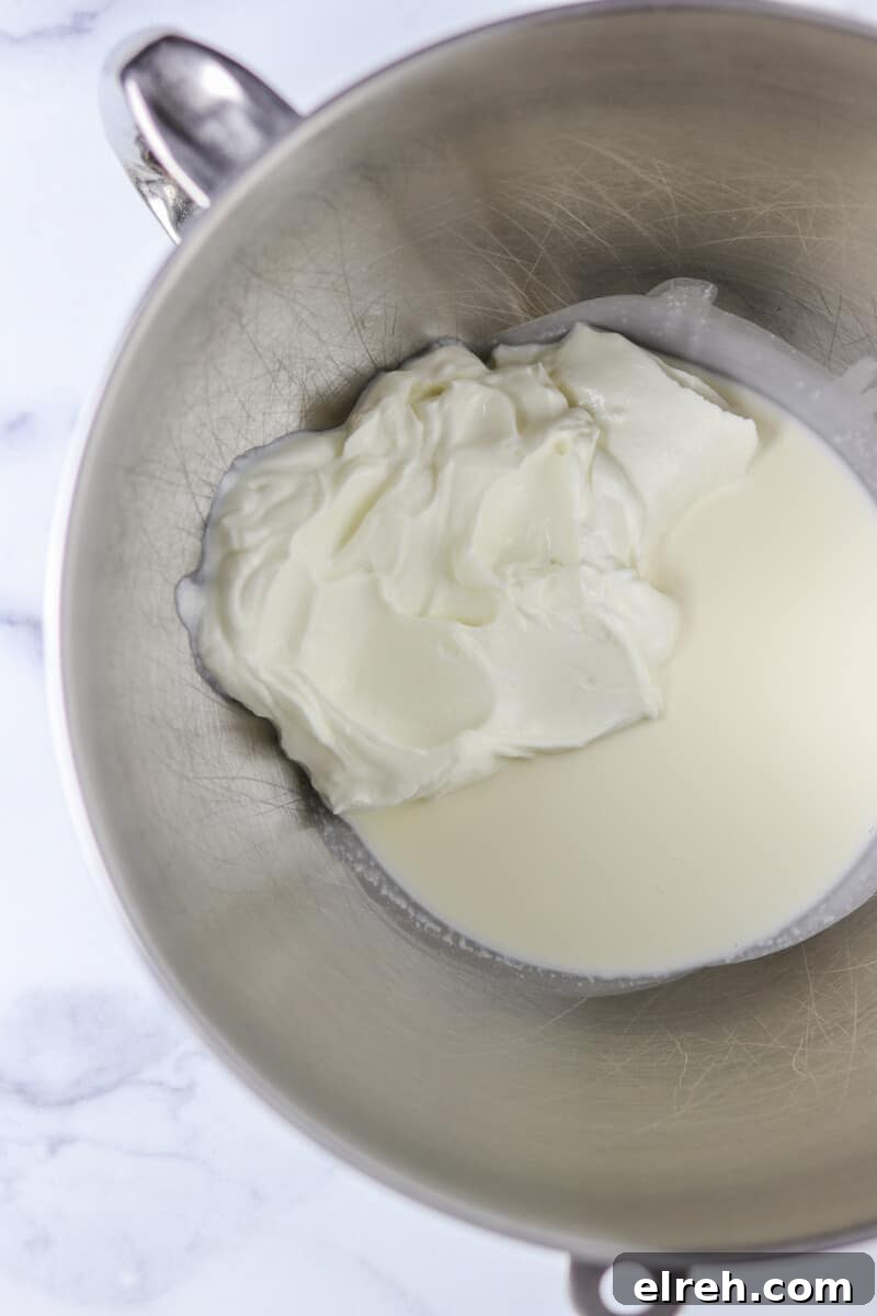 Cream and yogurt in a metal bowl.