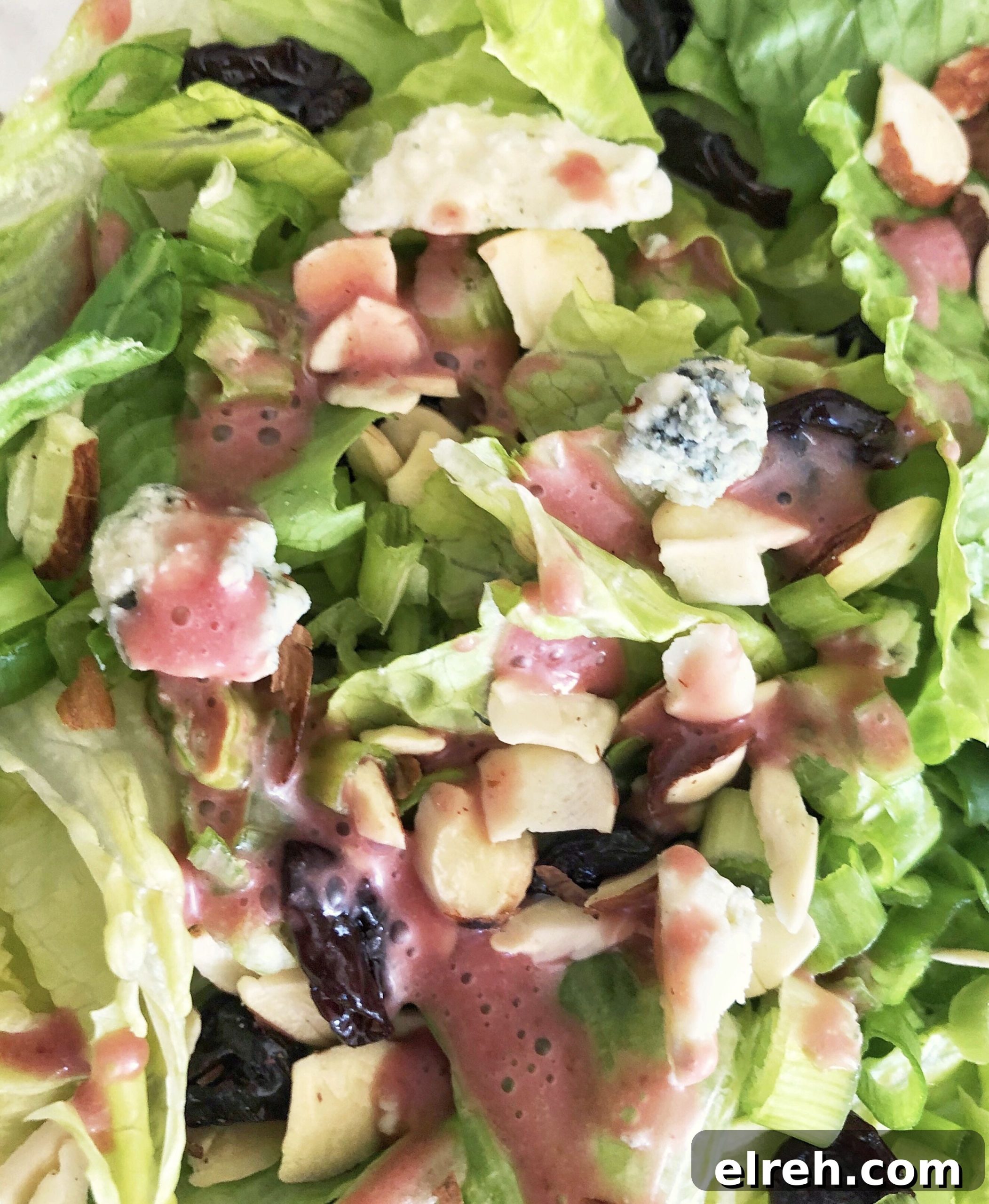 Cherry Vinaigrette Dressing with Balsamic and Honey 4 closeup of cherry vinaigrette salad dressing poured over salad