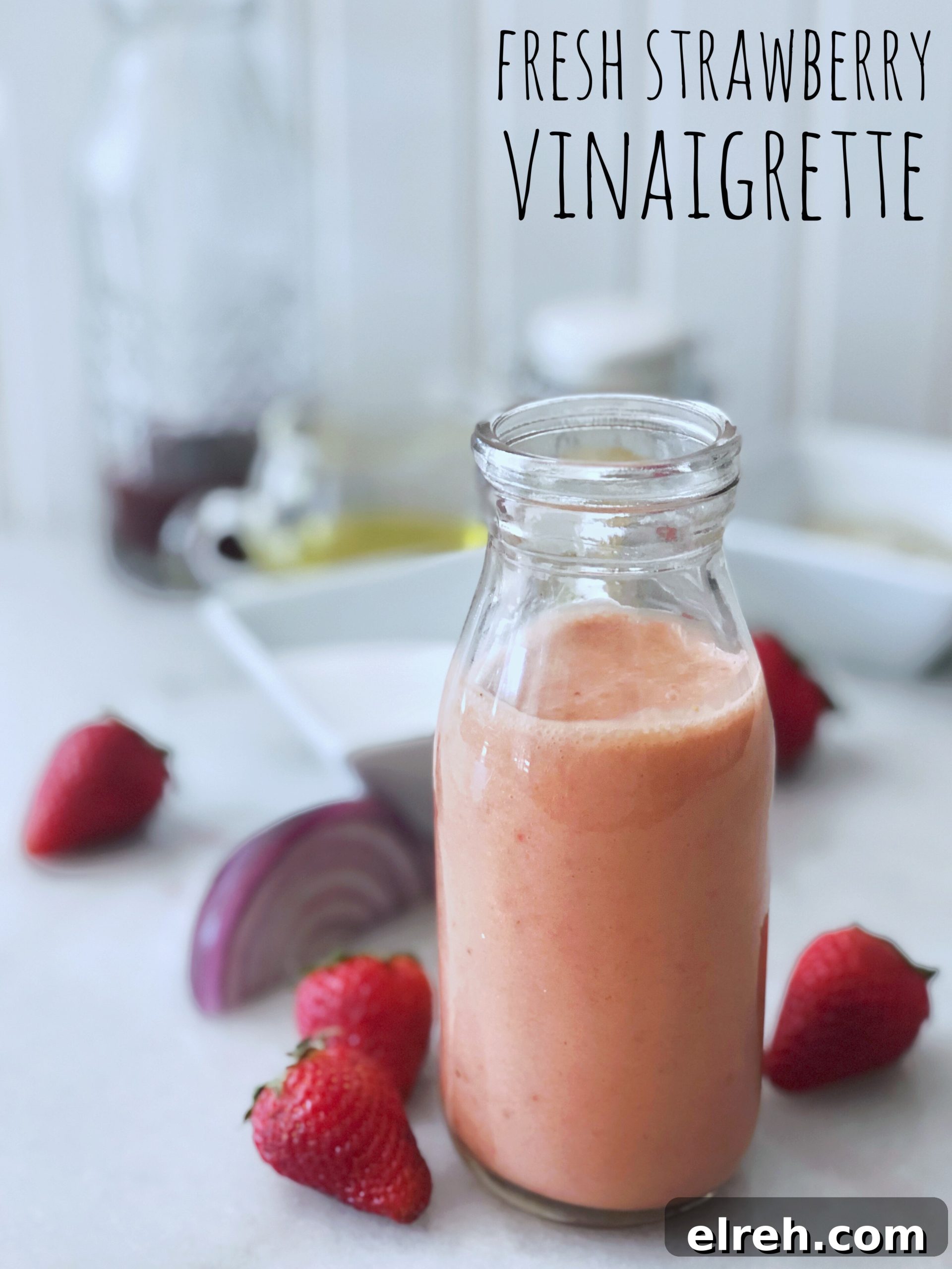 Cherry Vinaigrette Dressing with Balsamic and Honey 7 bottle of pink fresh strawberry vinaigrette and scattered ingredients