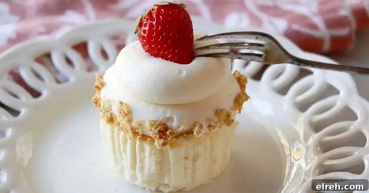 Mini Strawberry Cheesecake Bites Recipe 3 a strawberry mini cheesecake on a plate frosted with cream cheese buttercream