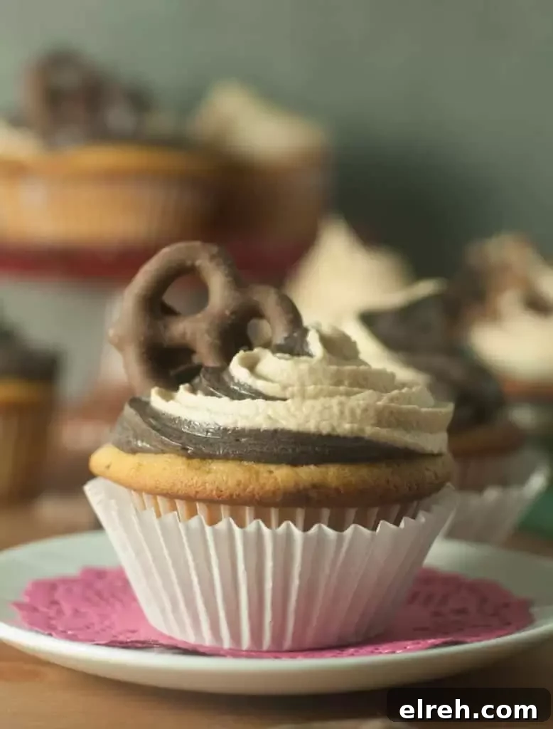 Chubby Hubby Cupcakes with Peanut Butter and Pretzels 2 Chubby Hubby cupcakes with vanilla malt cake, chocolate-covered pretzels, peanut butter chips, chocolate buttercream, and peanut butter frosting.
