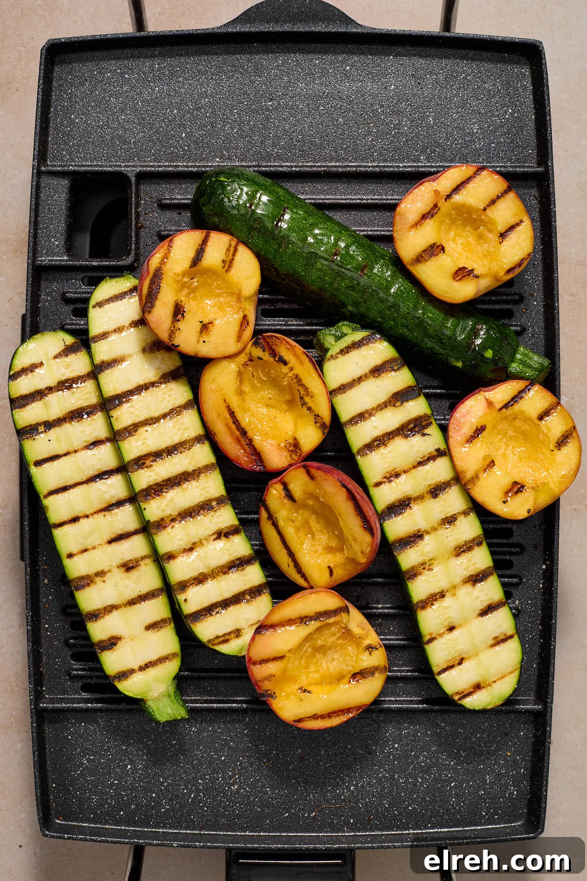 Grilled Vegetable Orzo Salad with Summer Peaches 7 Grilled zucchini and peaches on a grill.