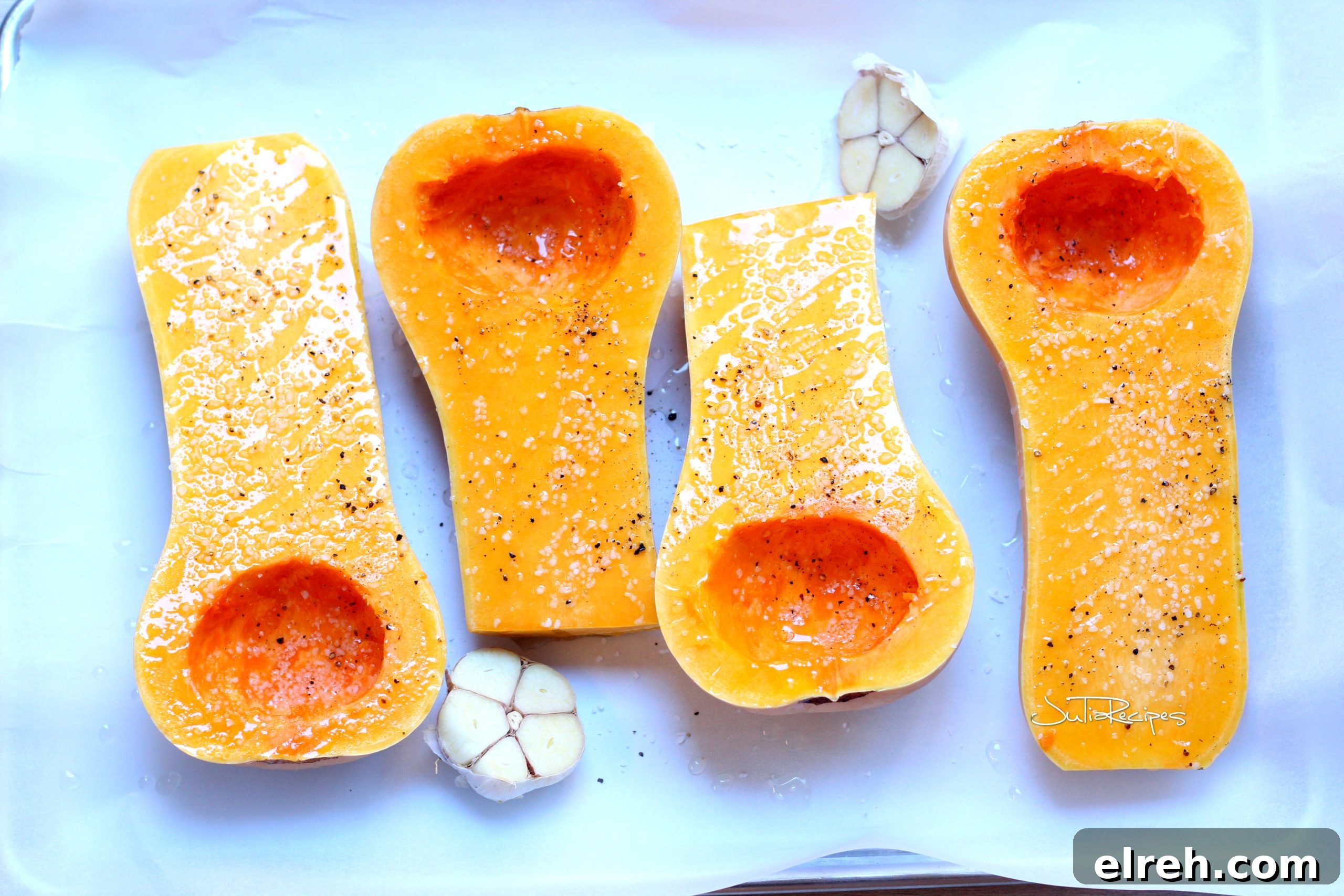 butternut squash cleaned, on baking sheet, drizzled with olive oil, seasoned with garlic
