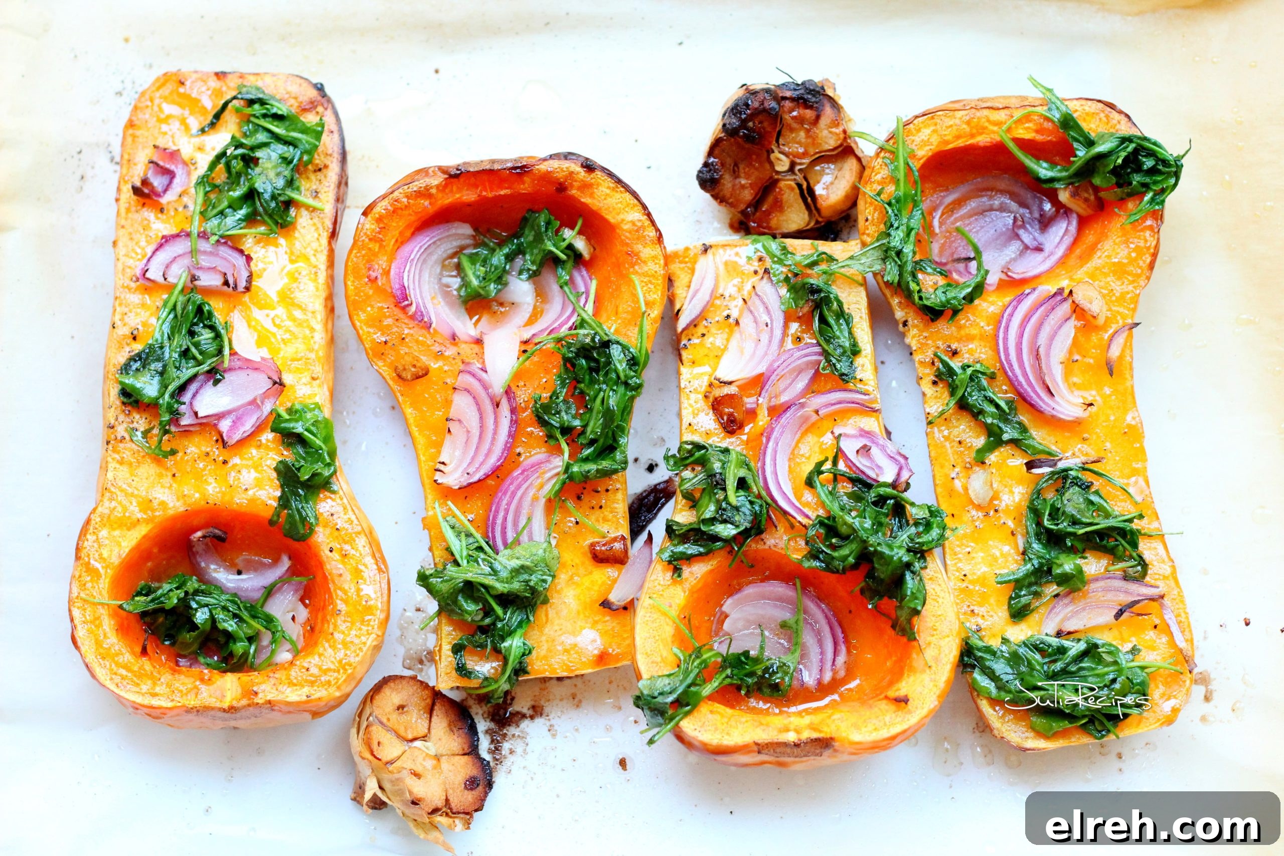 butternut squash dressed with arugula and red onion, with garlic