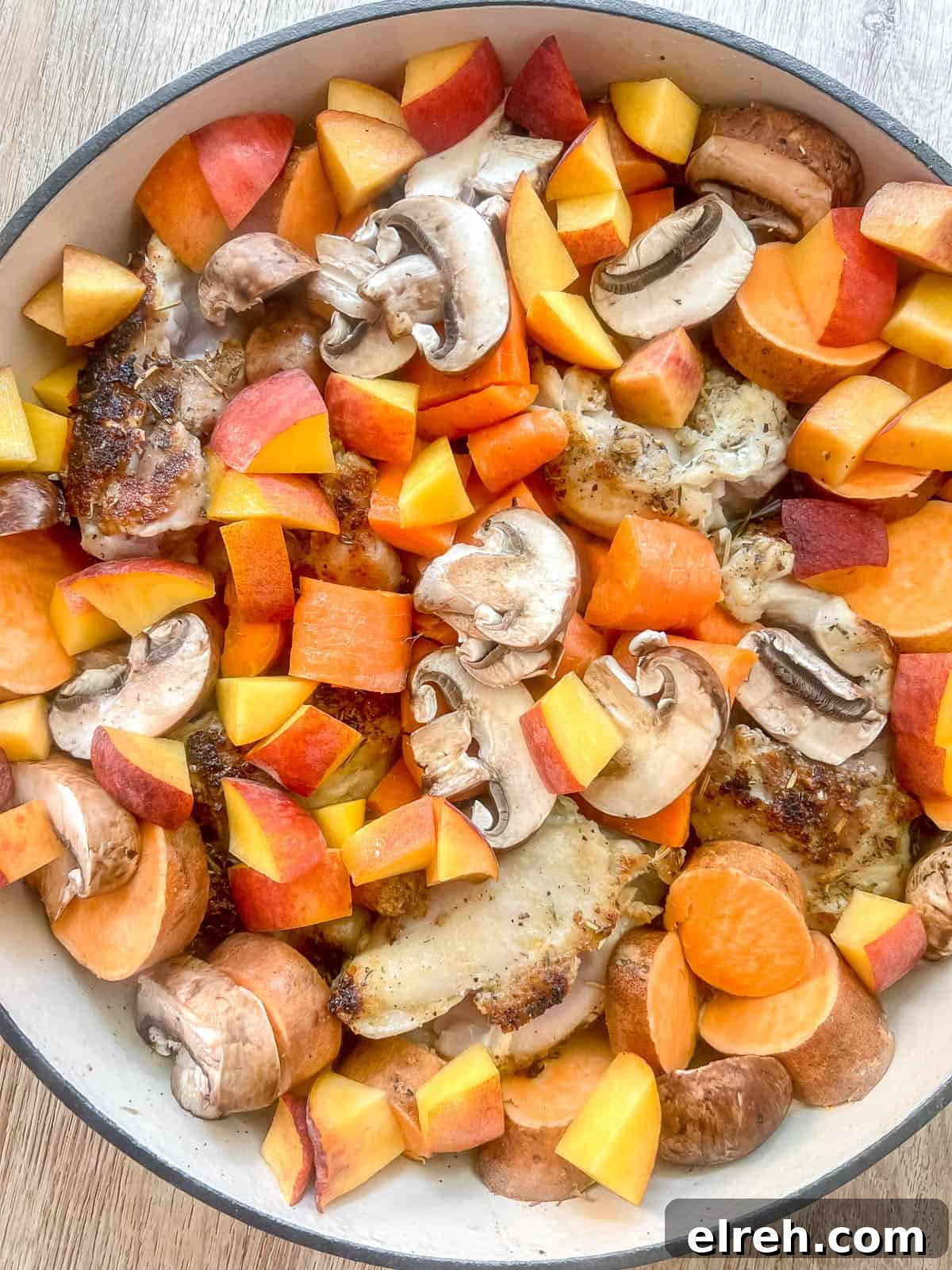 Maple Peach Chicken Thighs in a Dutch Oven 8 All the fruits and veggies added to the pan.