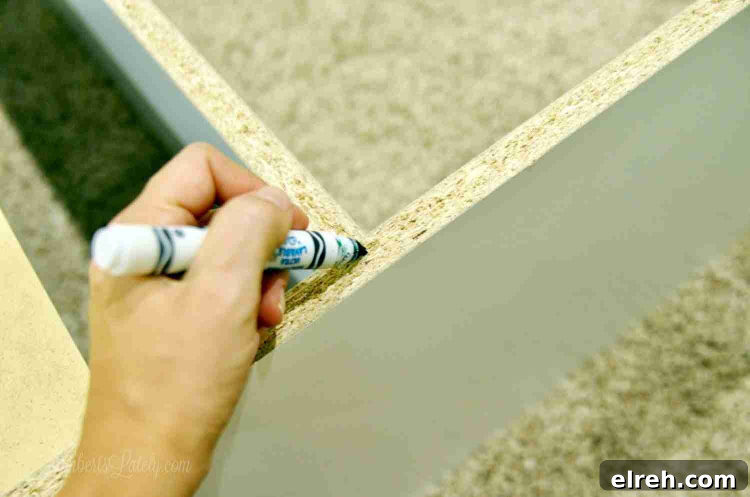 Turn IKEA Billy Bookcases into Built-In Shelving 5 marking back of cabinet with a marker.