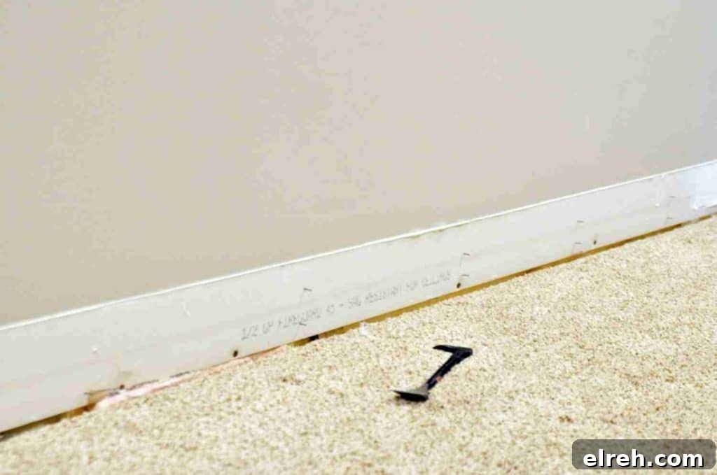 Turn IKEA Billy Bookcases into Built-In Shelving 9 baseboards taken off of a wall.