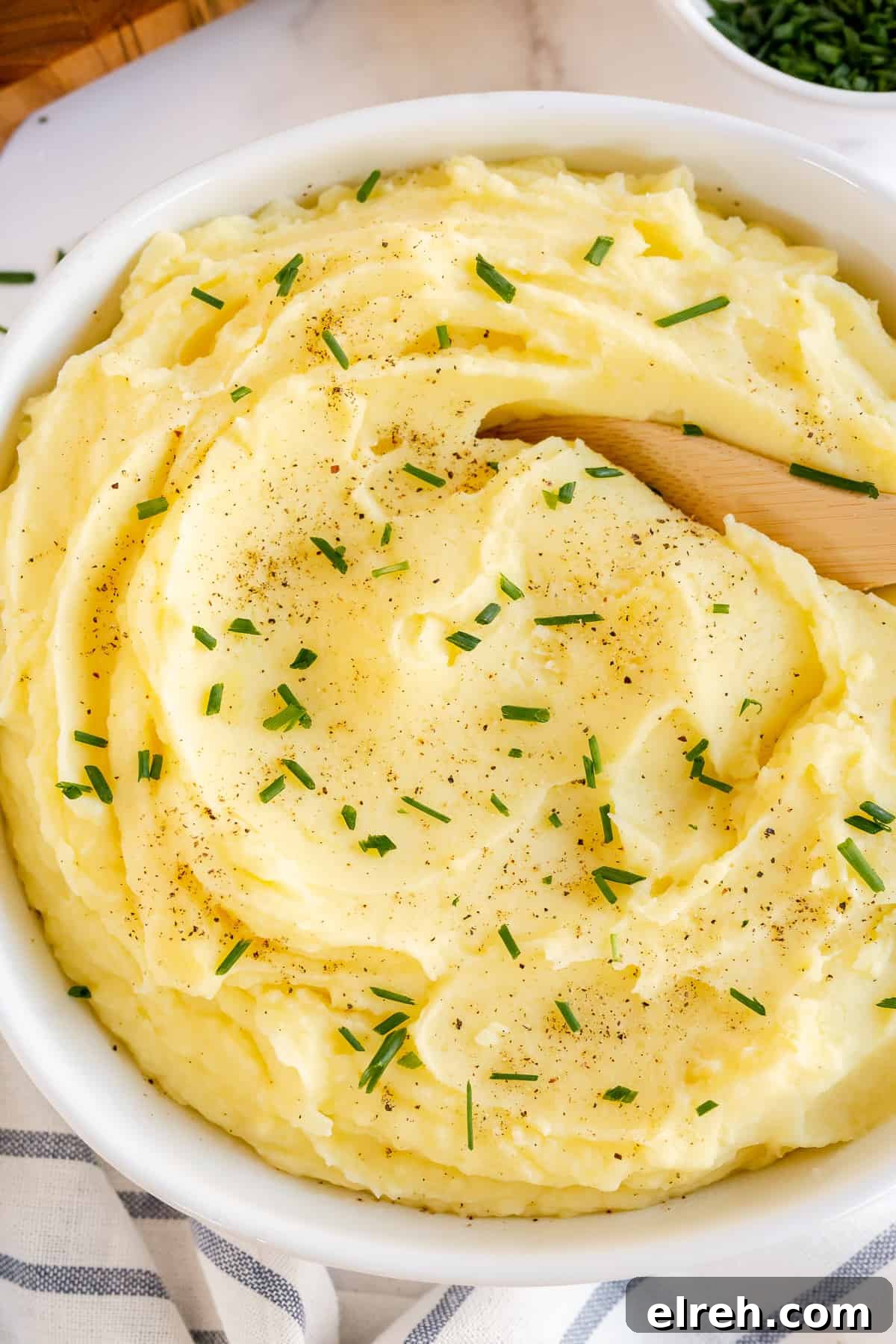 Creamy Buttermilk Mashed Potatoes Recipe 7 Mashed Potatoes in a serving dish topped with fresh chives