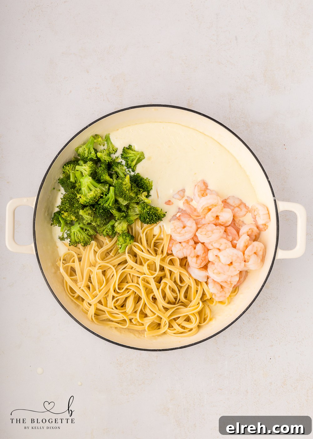 Add the shrimp, cooked fettuccine and broccoli to the pan