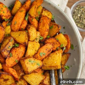 Plate of air fryer carrots and potatoes.