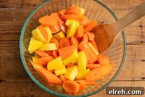 Carrots and potatoes tossed with oil.