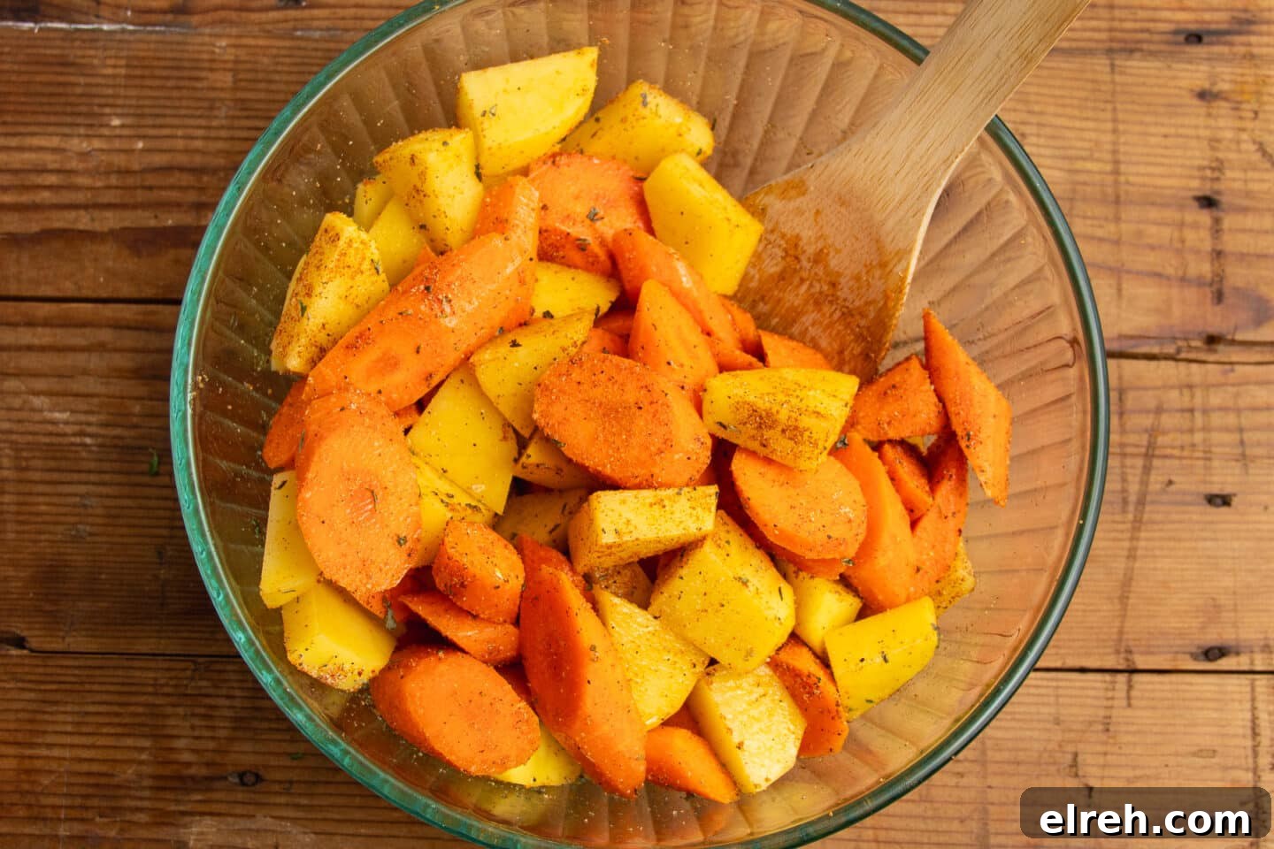 Carrots and potatoes seasoned with herbs and spices.