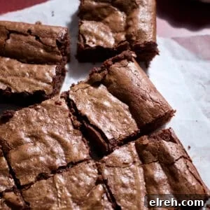 Sourdough Discard Brownies on white parchment paper.