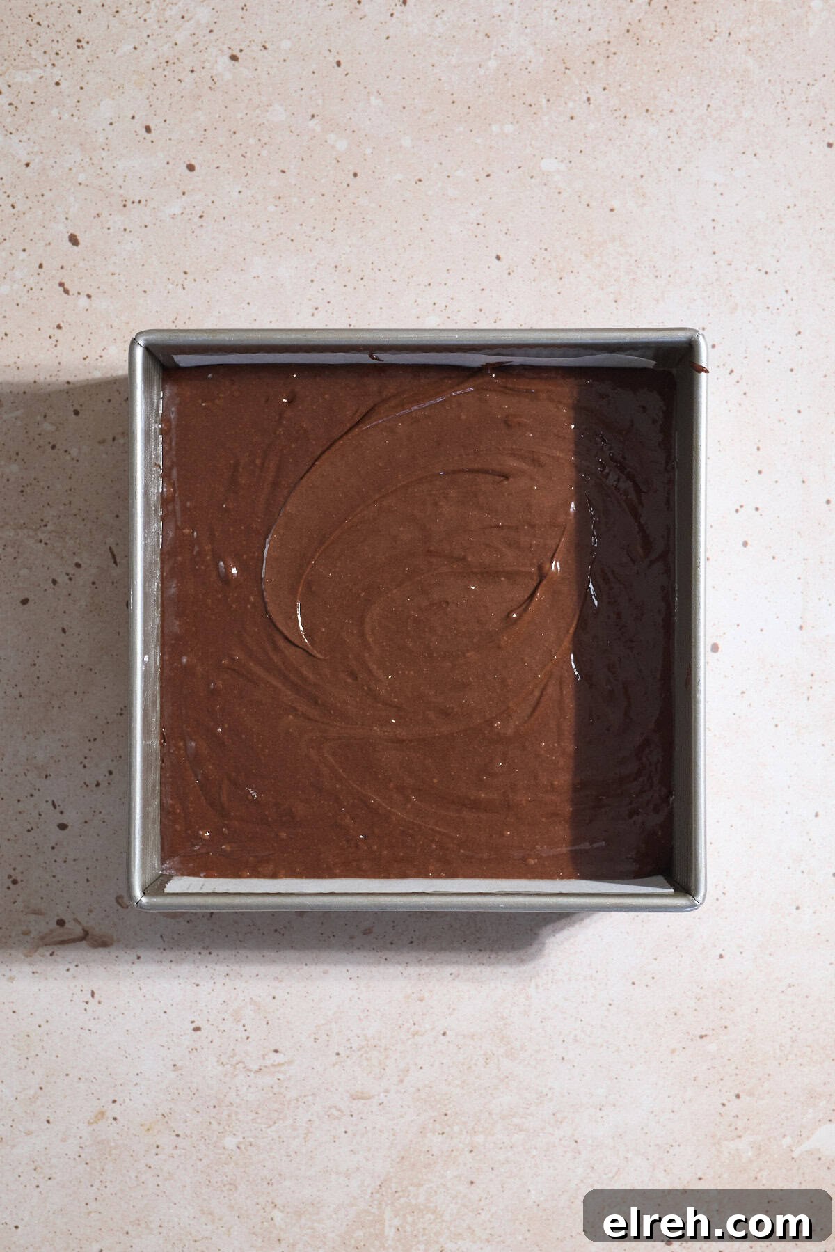 Batter spread into the baking pan.