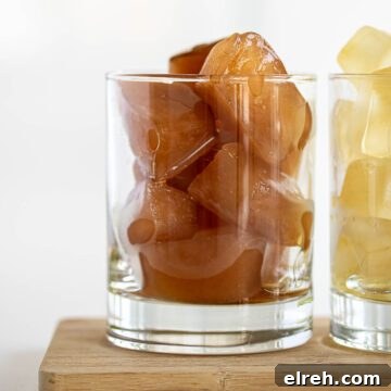 How to Make Tea Ice Cubes for Iced Tea, Lattes and Cocktails 12 Black and herbal tea ice cubes inside glass.