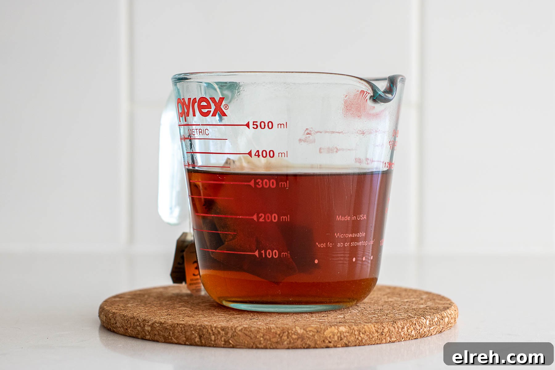 How to Make Tea Ice Cubes for Iced Tea, Lattes and Cocktails 3 Black tea bags steeping into hot water.