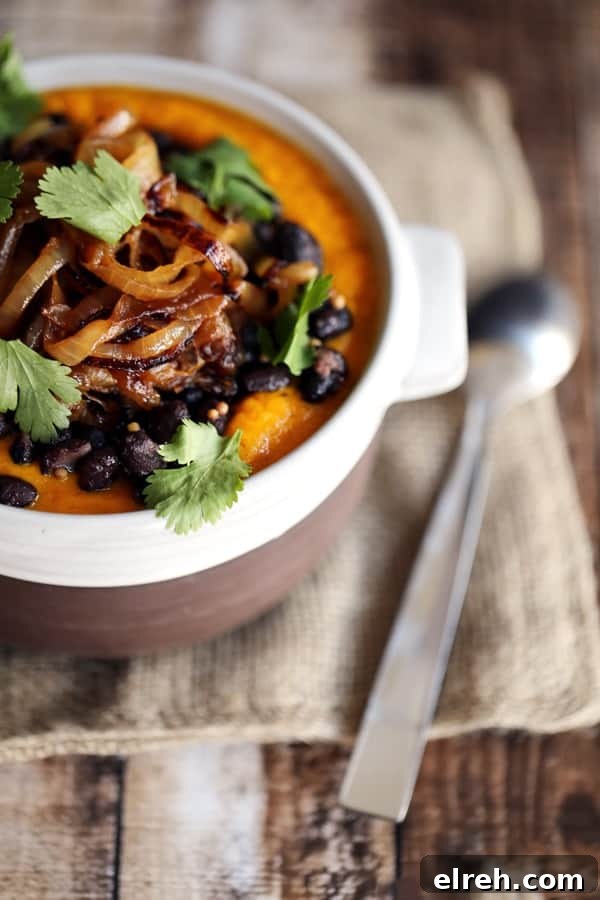 Bowl of Southwest Carrot and Black Bean Soup with cilantro