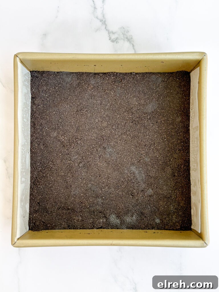 oreo cookie crust in baking pan.