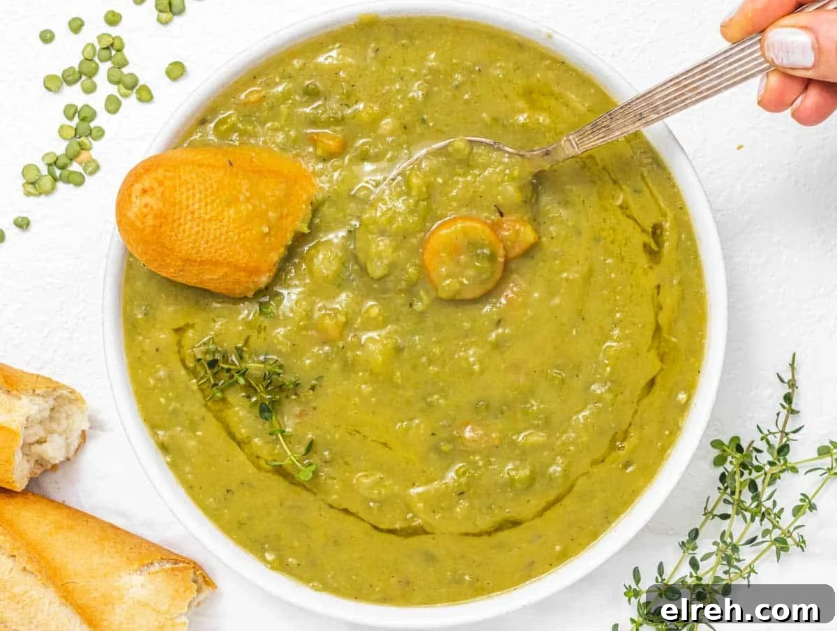 Classic Split Pea Soup Recipe with Ham 3 Split peas soup with hand and baguette