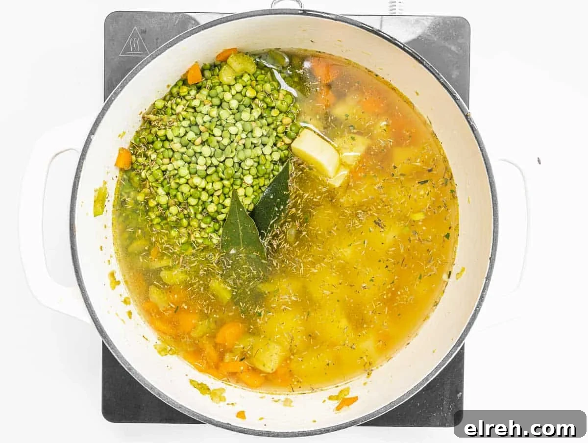 Classic Split Pea Soup Recipe with Ham 8 split peas and vegetable broth in a pot