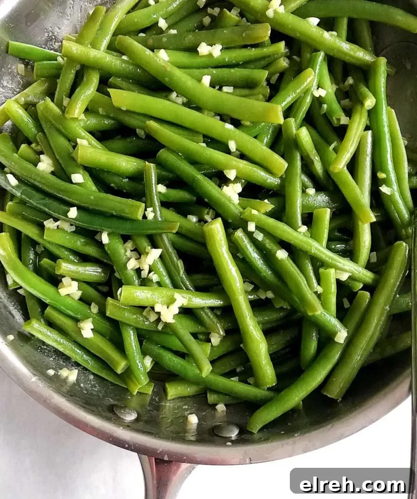 garlic green beans in skillet close up