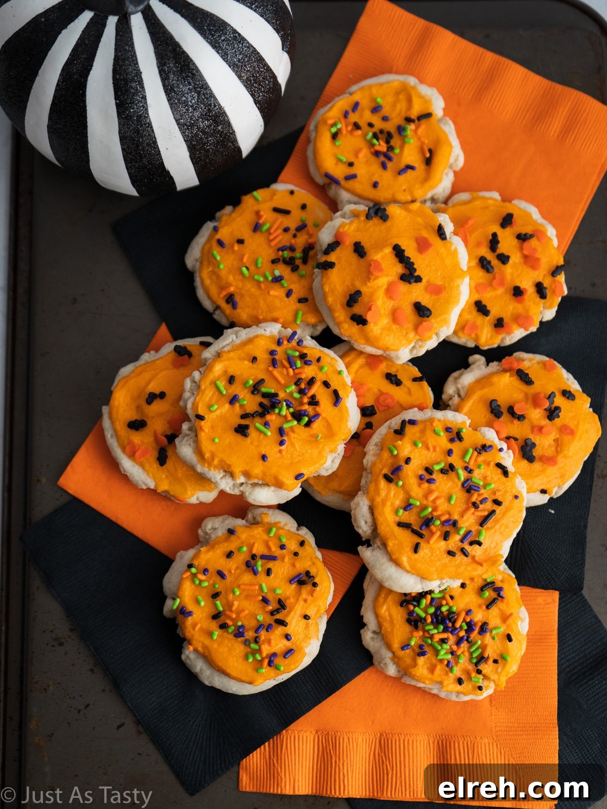 Orange frosted sugar cookies topped with Halloween sprinkles.