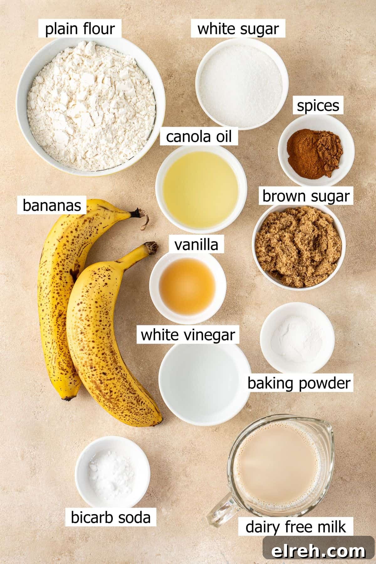 All ingredients needed to make vegan banana cake laid out in bowls.