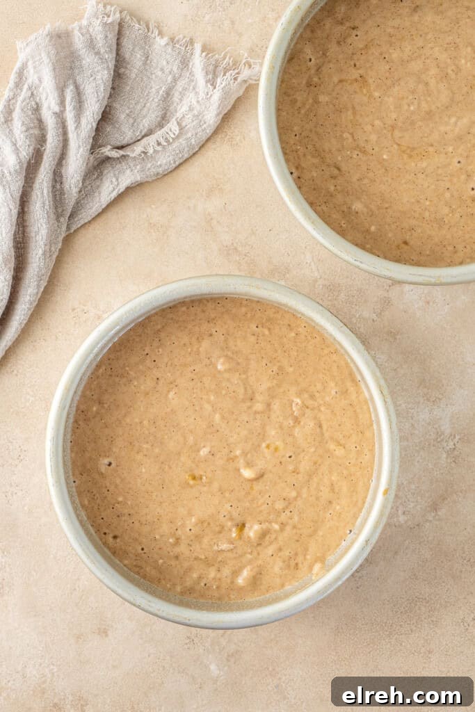 The cake batter in the cake pans.