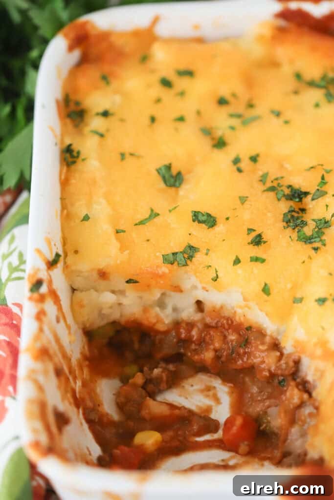 Shepherd's Pie Recipe with Savory Lamb and Mashed Potatoes 2 A casserole dish full of shepherd's pie with ground beef and mashed potatoes.