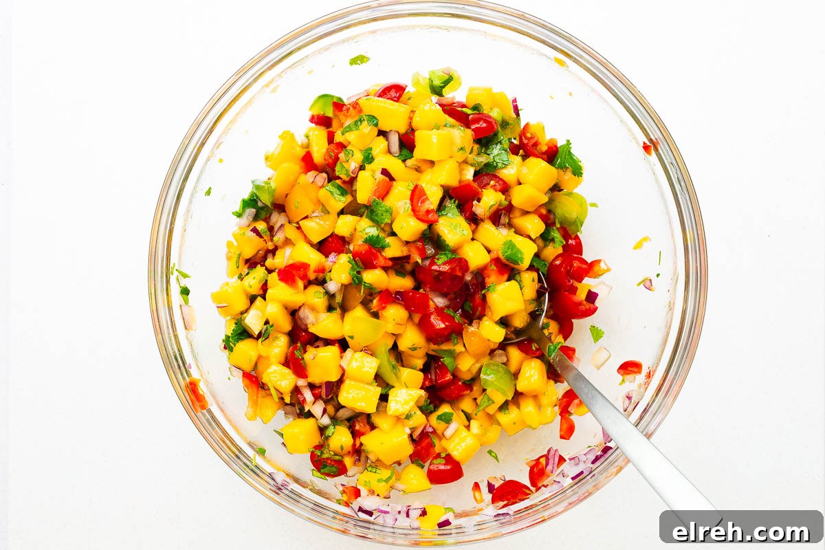 Fresh mango salsa ingredients mixed together.