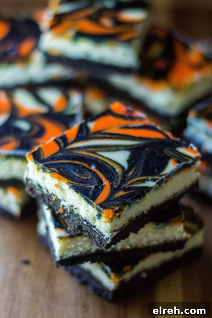 Spooky Halloween Cheesecake Bars with Candy Corn Swirl 3 Halloween Cheesecake swirled with orange and black