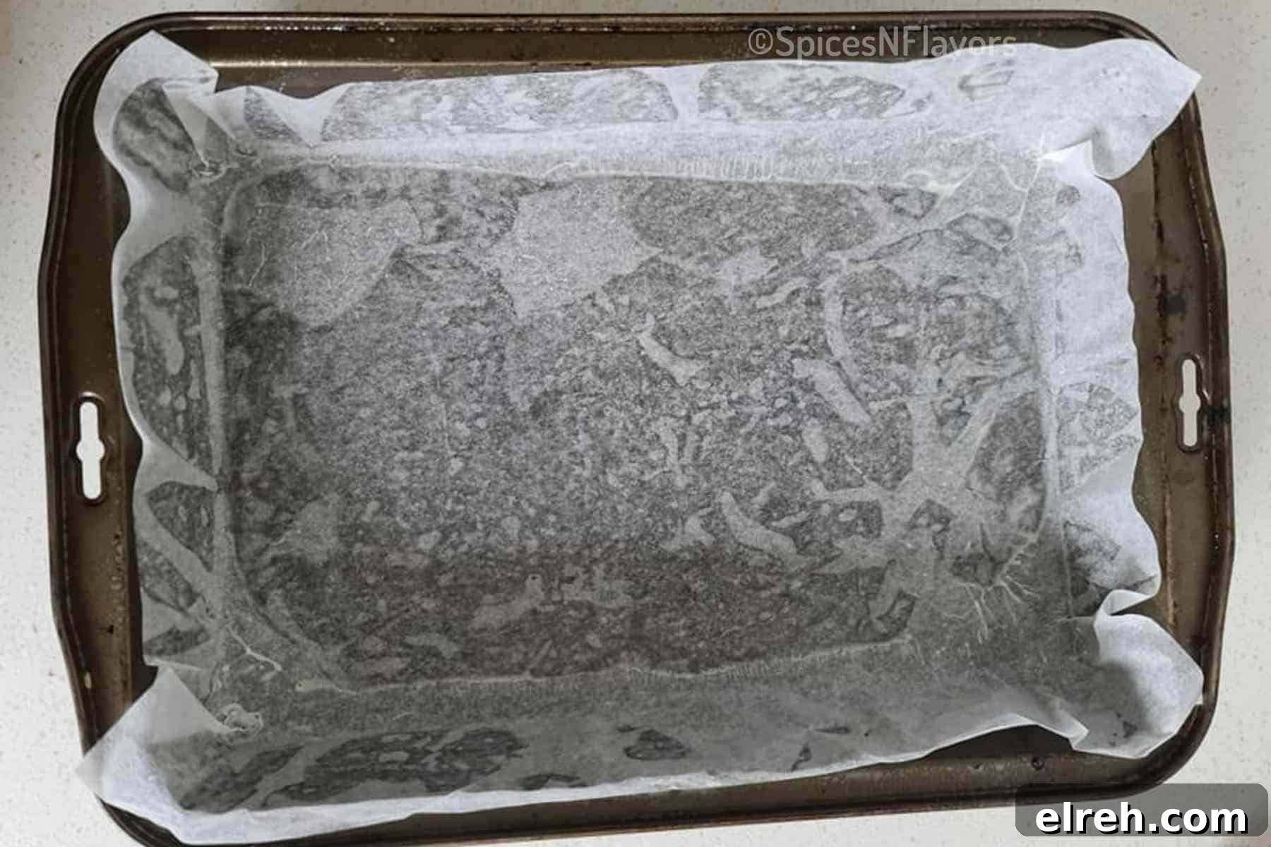 a cake pan lined with parchment paper