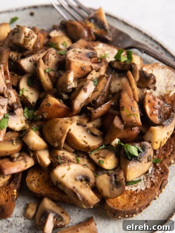Gluten-Free Seeded Loaf Recipe with Flax, Sunflower and Chia 11 garlic mushrooms on toast with a white plate