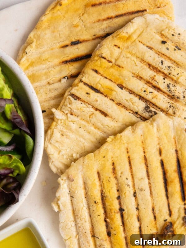 Gluten-Free Seeded Loaf Recipe with Flax, Sunflower and Chia 12 3 gluten free flatbreads on white plate.