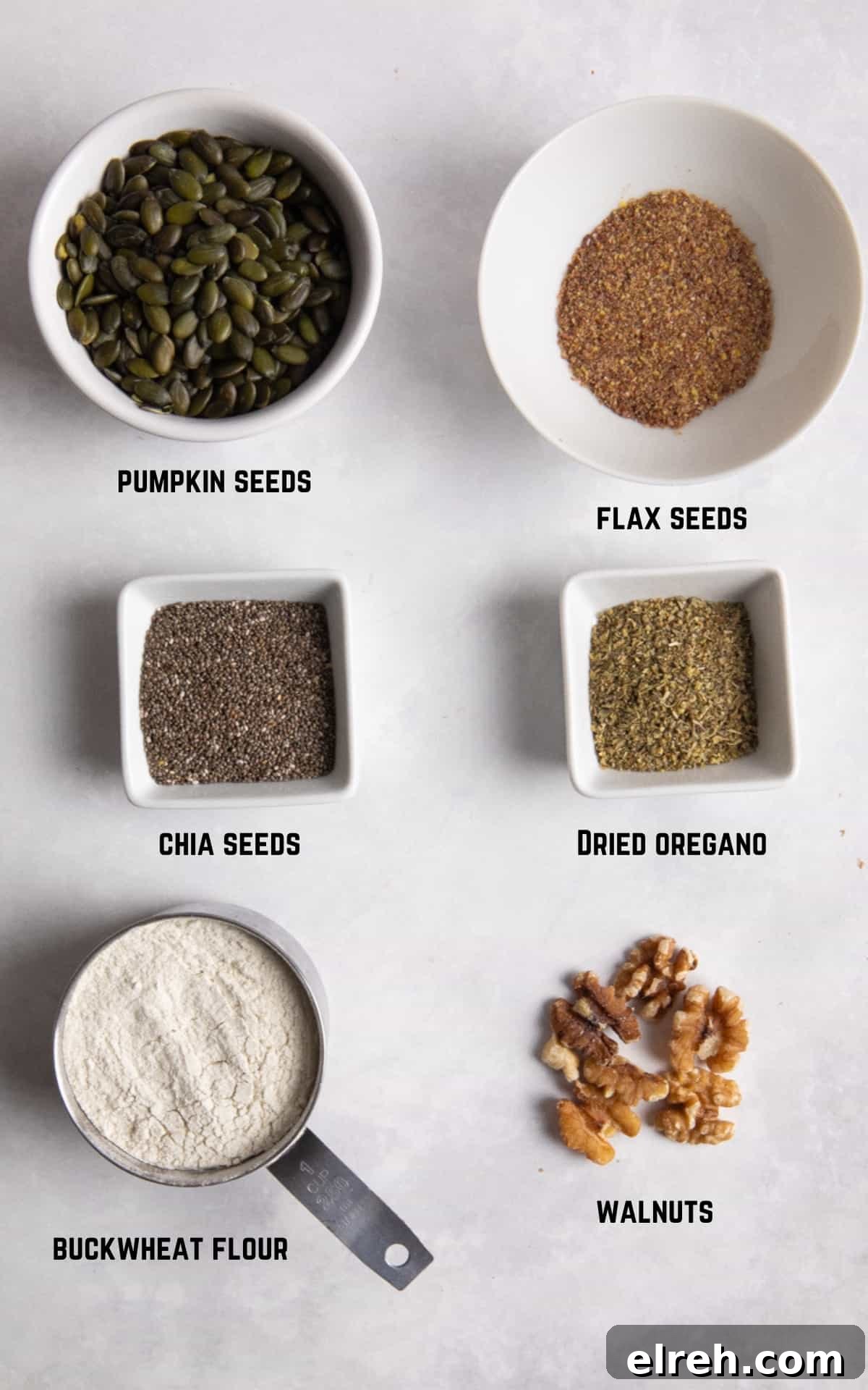 Gluten-Free Seeded Loaf Recipe with Flax, Sunflower and Chia 3 ingredients to make gluten free seeded bread on white surface.
