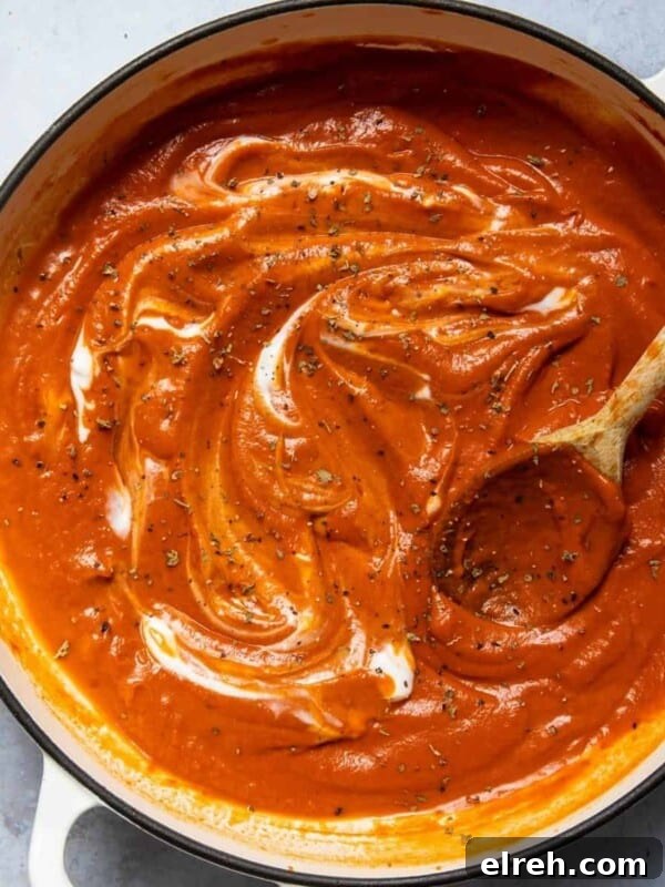 Gluten-Free Seeded Loaf Recipe with Flax, Sunflower and Chia 10 Tomato soup in a large pot with a wooden spoon.